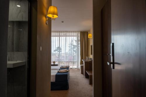 a hallway of a hotel room with a bathroom at Flamingo Beach Hotel in Sunny Beach