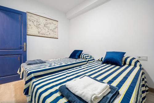 La Casa del Pescador Calafellmarにあるベッド