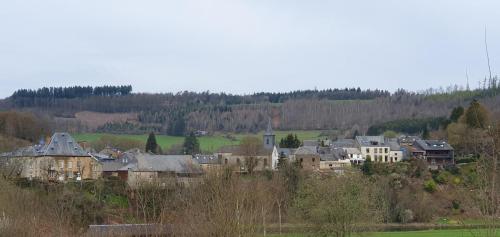 a group of houses in a town with trees at Chalet Les Allores Dohan (Bouillon) in Bouillon