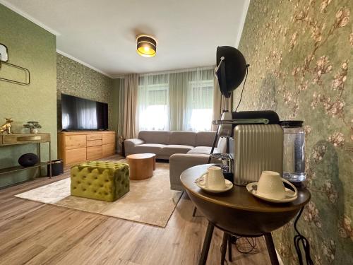 a living room with a couch and a table at MILIA wine & event resort in Dunajský Klátov