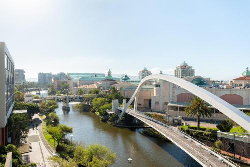 a white bridge over a river in a city at Crystal Towers 212 in Cape Town