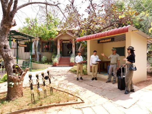a group of people standing outside of a building at Tathastu Kanha in Kānha
