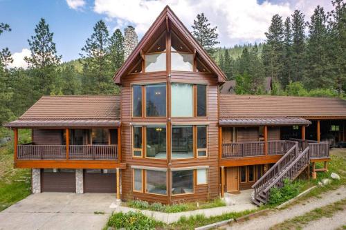 a large wooden house with a large deck at Icicle View in Leavenworth