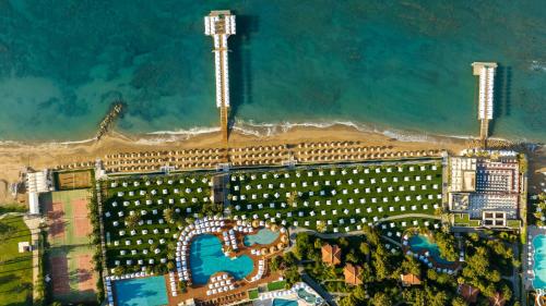 an overhead view of a large building with a beach at Voyage Sorgun Hotel in Side