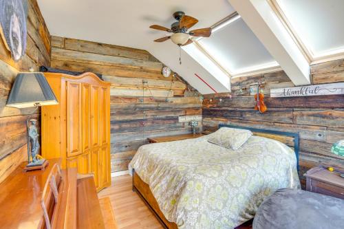 a bedroom with wooden walls and a bed in a room at Windham Mountain Vacation Rental about 3 Mi to Lifts! in Windham