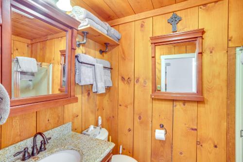 a wooden bathroom with a sink and a mirror at Windham Mountain Vacation Rental about 3 Mi to Lifts! in Windham