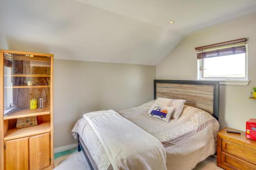 a bedroom with a bed and a dresser and a window at Windham Mountain Vacation Rental about 3 Mi to Lifts! in Windham