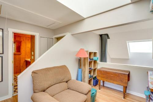 a living room with a chair and a table at Windham Mountain Vacation Rental about 3 Mi to Lifts! in Windham