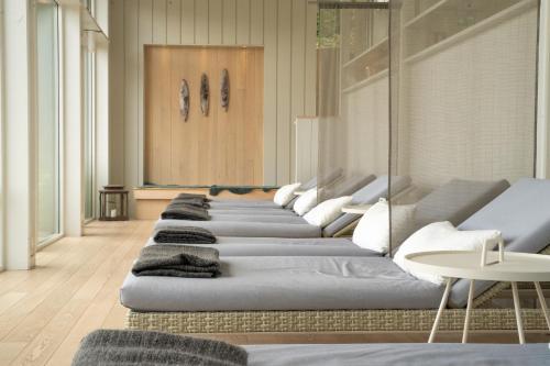 a row of couches lined up in a room at Skepparholmen Nacka in Nacka