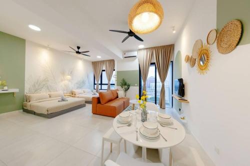 a living room with a table and a couch at The Pano Residence Jalan Ipoh Insta-worthy Bath Tub Studio 浴缸MRT in Kuala Lumpur