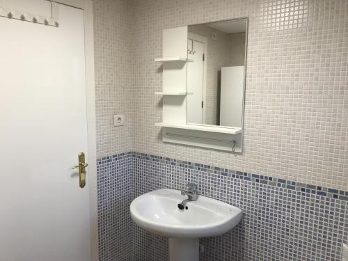 a bathroom with a sink and a mirror at Villa Estrella with private pool in Mazarrón