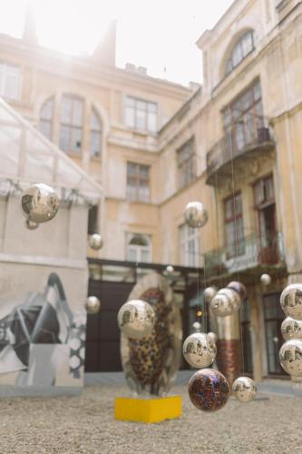 a display of balls in a window of a building at Gruner Hotel in Lviv
