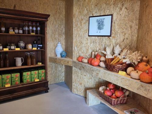 a store with baskets of fruits and vegetables on display at Apartment Matthäus in Cermes