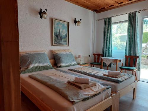 Posteľ alebo postele v izbe v ubytovaní Pension Welserhof