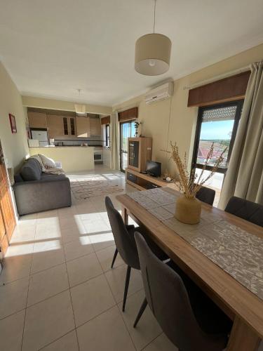 a living room with a dining table and a couch at Mantamar I in Manta Rota
