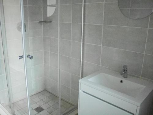 a bathroom with a shower with a sink and a toilet at 6 The Blyde Crystal Clear Lagoon 2 Bedroom Apartment in Pretoria