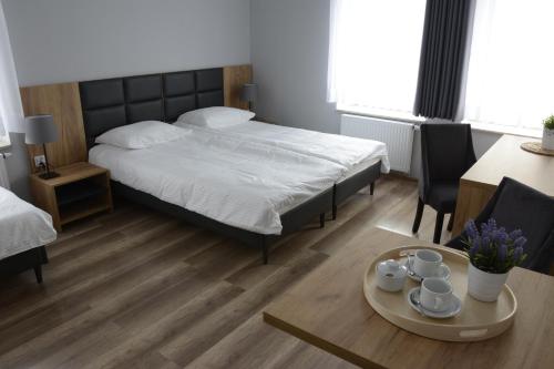 Una cama o camas en una habitación de Jurajska Przystań
