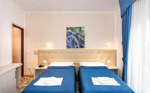 Postel nebo postele na pokoji v ubytování Hotel Caribe