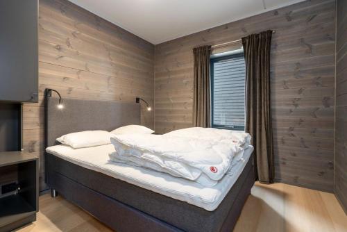 Ένα ή περισσότερα κρεβάτια σε δωμάτιο στο Riddertunet apartment 104 - in the center of Beitostølen
