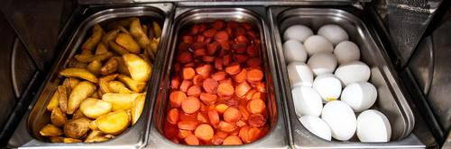 four trays of different types of food in a drawer at Lapis Inn Hotel & Spa ( Ex. Ambassador Hotel) in Istanbul