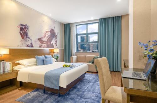 Postel nebo postele na pokoji v ubytování Zhongshan Bafei Hotel