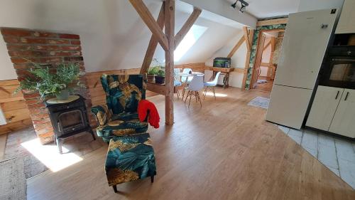 an overhead view of a living room with a fireplace at Ostoja Leśna Cisza in Purda
