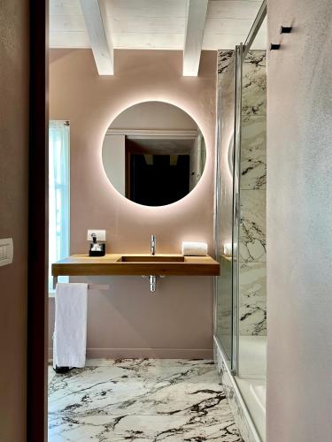 a bathroom with a sink and a mirror at Vulcano Palace in Castro