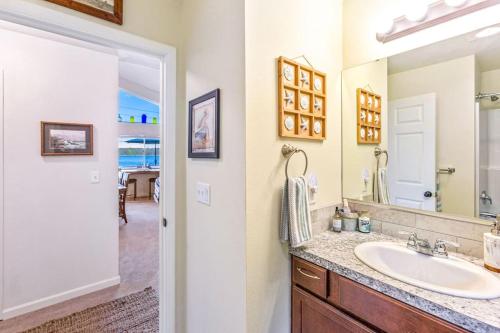 a bathroom with a sink and a mirror at Seal Rock Cottage in Brinnon
