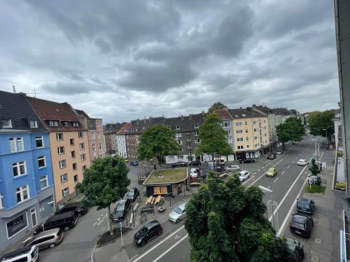 a view of a city with cars parked on a street at Nähe BVB Stadion Dortmund City Innenstadt in Dortmund