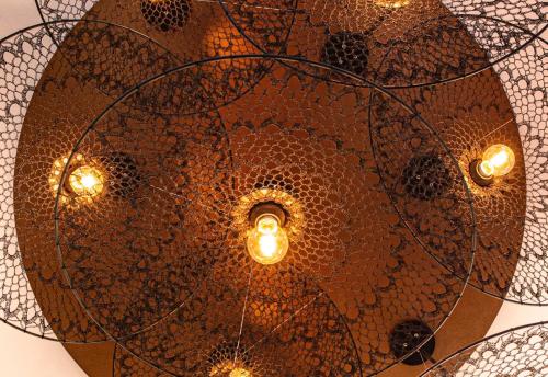 a close up of a ceiling with lights at Circa 1928 in Albury