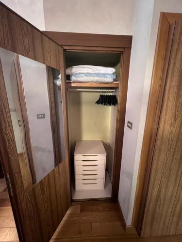 a walk in closet with a dresser in a room at Residence Star in Turin