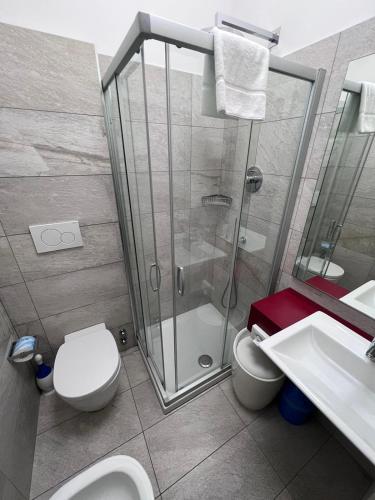 a bathroom with a shower and a toilet and a sink at Residence Star in Turin