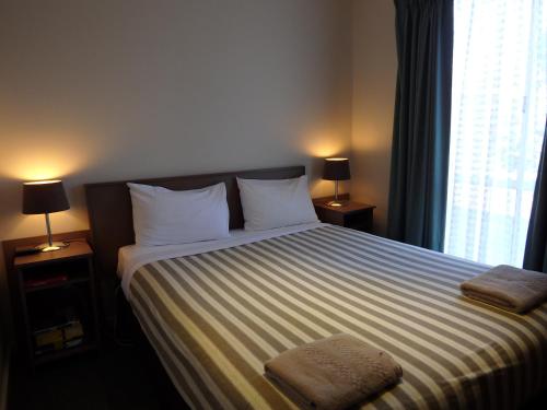 Werribee Motel and Apartmentsにあるベッド