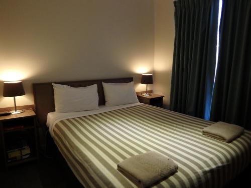 Werribee Motel and Apartmentsにあるベッド