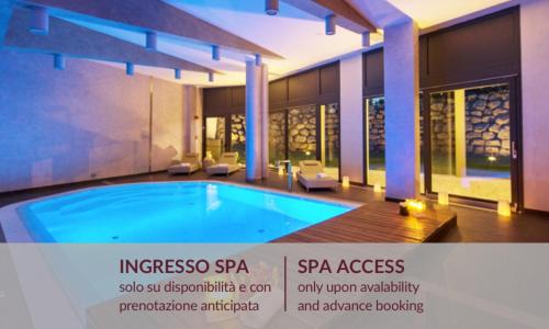 an image of a swimming pool in a house at Winter Garden Hotel Bergamo Airport in Grassobbio