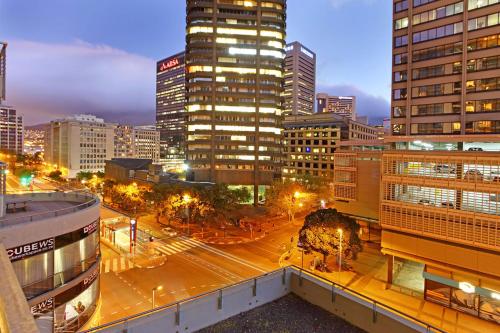 a city skyline at night with tall buildings at Icon Cape Eazi Stayz in Cape Town