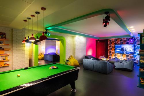 a billiard room with a pool table in it at Kings' Valley Medical & Spa Hotel in Kazanlŭk