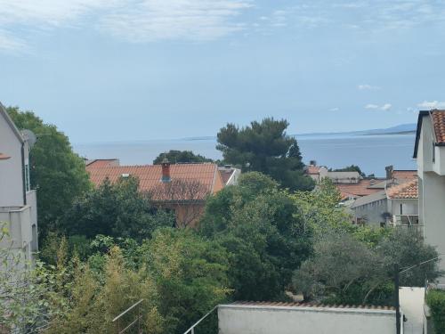 a view of a city with houses and trees at Apartment Alafetic in Krk