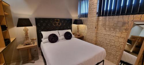 Postel nebo postele na pokoji v ubytování Puerto Principe LOFT