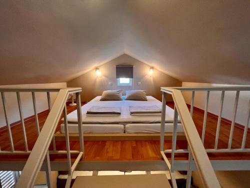 a bed in a room with two bunk beds at Apartments Zore Dubrovnik in Dubrovnik