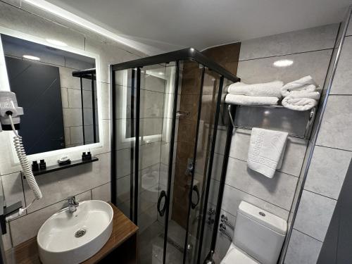 a bathroom with a shower and a sink at Bademi Room in Edirne