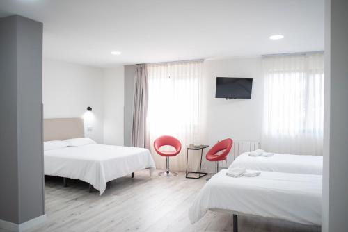 Katil atau katil-katil dalam bilik di Hotel Montañés