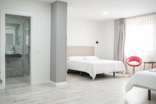 Katil atau katil-katil dalam bilik di Hotel Montañés