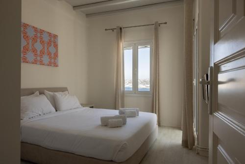Amaris Mykonian Residenceにあるベッド