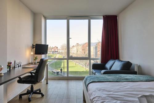 a bedroom with a bed and a desk and a chair at For Students Only Exquisite Modern Studios at Upperton Road in Leicester in Leicester