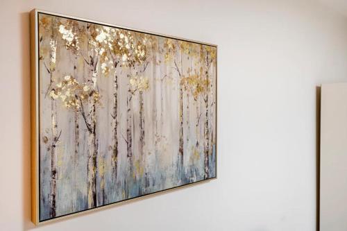 a painting hanging on a wall in a room at Birmingham City Centre Apartment room near China Town in Birmingham