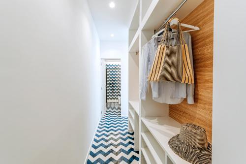 a hallway with a blue and white checkered floor at Davalos 14 Luxury Home in Ischia