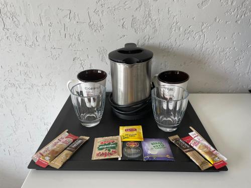 a black tray with a coffee maker and two glasses at Villa Oliva Butik Hotel in Bodrum City
