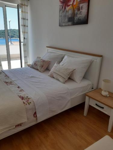 Posteľ alebo postele v izbe v ubytovaní Apartments Žerjav