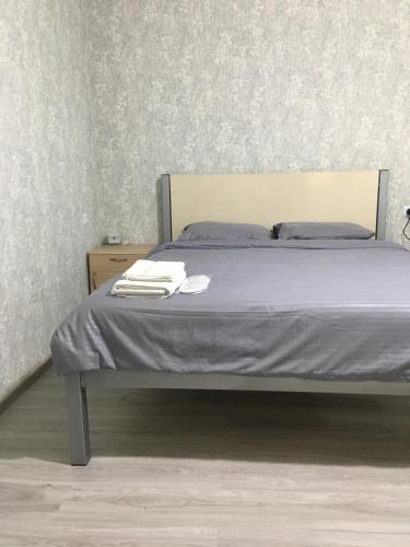 a bed with two towels on it in a bedroom at Bardy guest house in Chʼiva